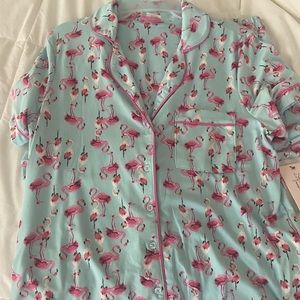 Medium sized matching flamingo pajamas.